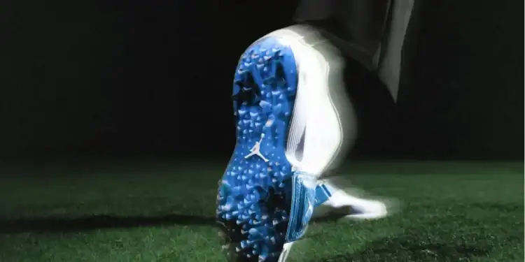 Jordan Brand Air Rev: New Golf Shoe with Flight Lock Tech Golfer wearing the Jordan Brand Air Rev shoes, demonstrating stability and style on the golf course with matching apparel.