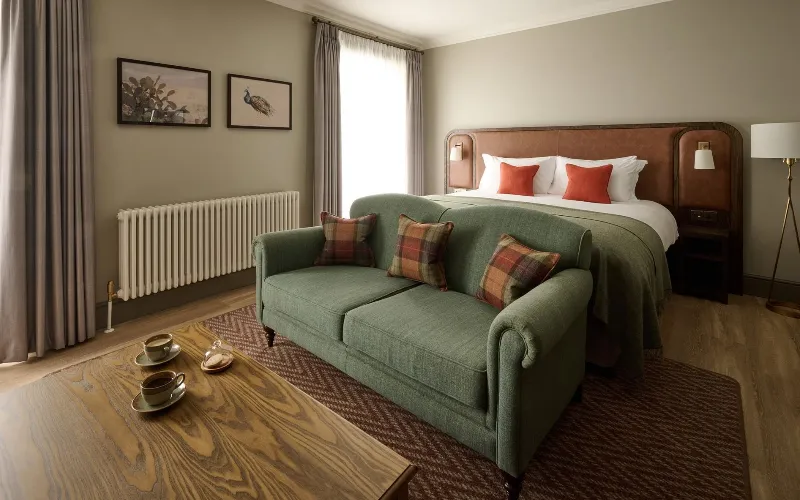 The Leddie a Standout Stay on Scotland’s Golf Coast a room with a bed and a couch