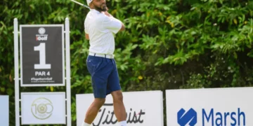 a man swinging a golf club