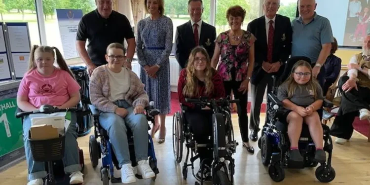 Bert Dyson Classic Raises £9,000 and Delivers Independence a group of people posing for a photo