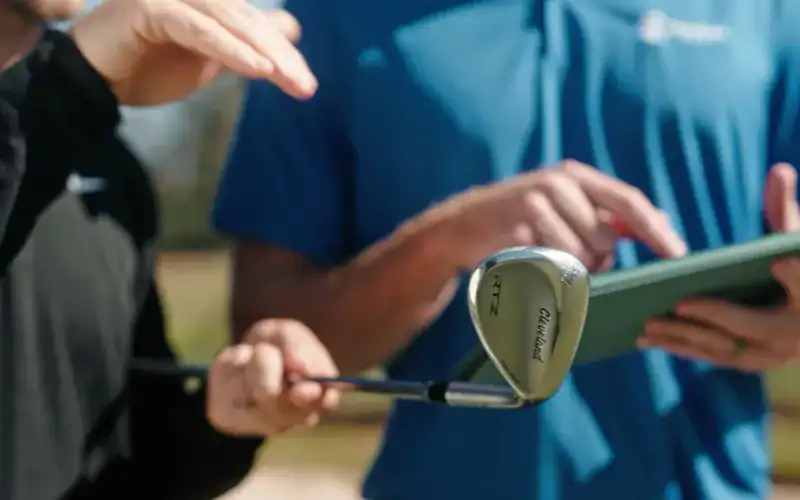 Cleveland Golf Unveils RTZ Wedges with Rust-Proof Raw Finish Golfers reviewing the new Cleveland RTZ wedge, designed for rust-free performance with Z-Alloy.