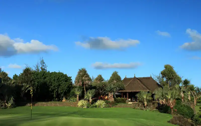 Anahita Golf & Spa Resort Welcomes New Management Partner A golf course with a building and trees.
