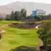 La Cala Resort Expands Golf Experience with New Short Course a golf course with a building in the background