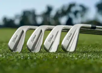 a group of golf clubs on grass