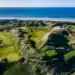 Discover Why Northern Ireland is a Golfer’s Paradise A golf course with the sea and beach in the background.