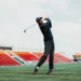 PUMA Golf & Reigning Champ: Field to Fairway Collaboration Rickie Fowler swinging a golf club.