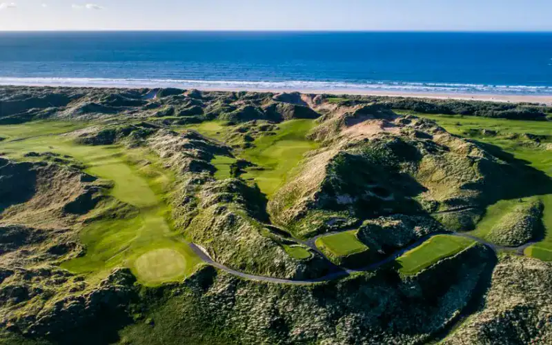 Discover Why Northern Ireland is a Golfer’s Paradise A golf course on a beach.