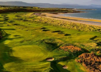 Royal Dornoch Launches Coastal Monitoring Plan a golf course with sand bunkers and a beach