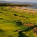 Royal Dornoch Launches Coastal Monitoring Plan a golf course with sand bunkers and a beach
