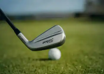 The new Titleist Expands T-Series with New T250•U and U•505 Utility Irons addressing a golf ball.