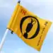 The 153rd Open at Royal Portrush Sets New Records a yellow flag with a black and red design on it