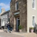 The Leddie a Standout Stay on Scotland’s Golf Coast a man and woman walking in front of a building