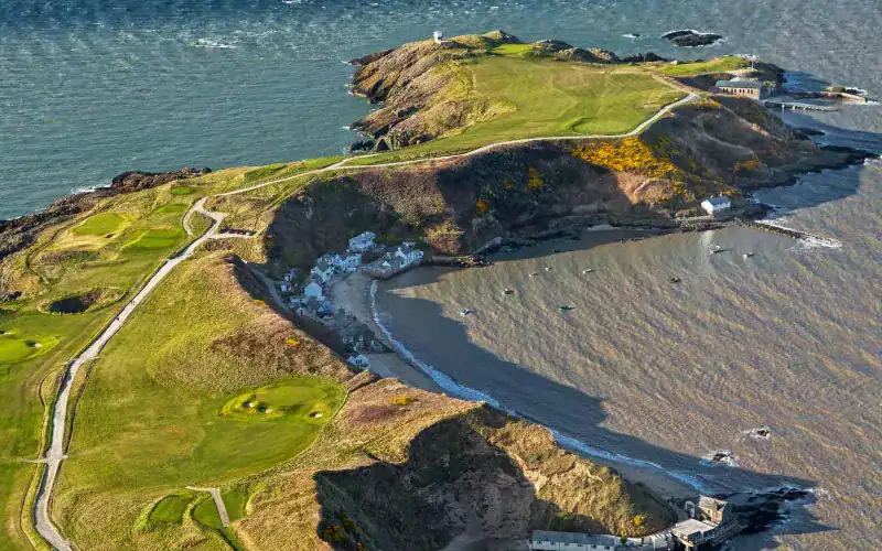 Nefyn Golf Club Society Golf Day Deals The ‘Point’ or the ‘old front nine’ as it was before the additional 9 inland holes were constructed in the 1930’s, is one of the most famous golfing landmarks in Wales.