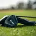 Titleist Launches GT1 3TOUR Fairway with Lower Spin Titleist GT1 3TOUR fairway wood resting on fairway grass with headcover in background.