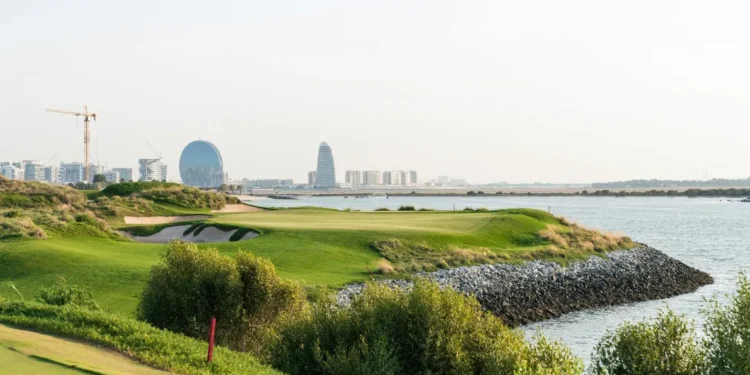 Viya Golf GEO Certification for Yas Links and Yas Acres a golf course with water and city in the background