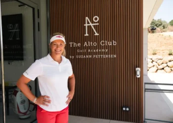a woman standing in front of a door