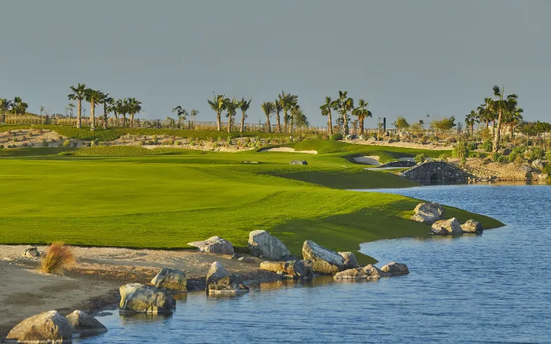 Viya Golf GEO Certification for Yas Links and Yas Acres a golf course with water and rocks
