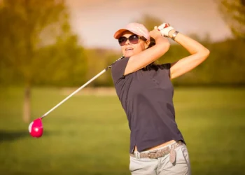 iGolf Launches 'It’s Your Game' to Empower Female Golfers a woman swinging a golf club