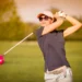 iGolf Launches 'It’s Your Game' to Empower Female Golfers a woman swinging a golf club