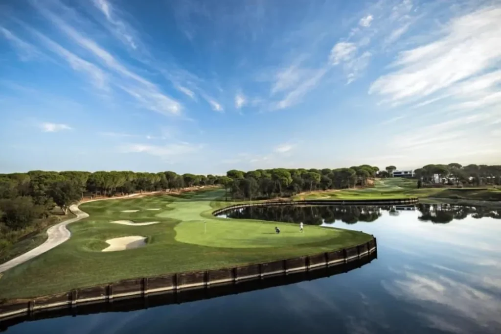 IGTM Reveals Key Golf Travel Trends for 2025 a golf course with water and trees