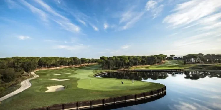 Camiral to Host 2031 Ryder Cup in Spain a golf course with water and trees
