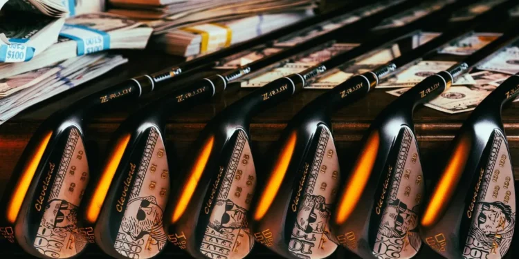 Limited-Edition SWAG RTZ Wedge from Cleveland Golf Golf clubs with cash-themed designs.