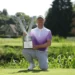 Horsey Ends Nearly 10-Year Drought with Dramatic Victory a man holding a trophy
