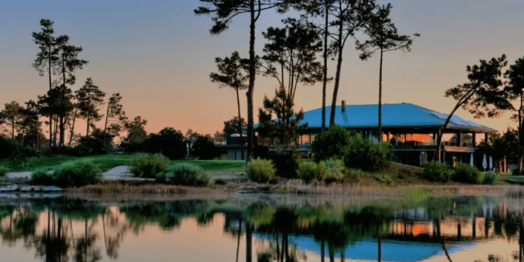 Details strengthens Portugal presence with Tróia Resort acquisition a house next to a body of water