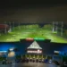 Late Nights, More Golf: Trafford Golf Centre Extends Hours! a building with a golf course and cars parked in front of it