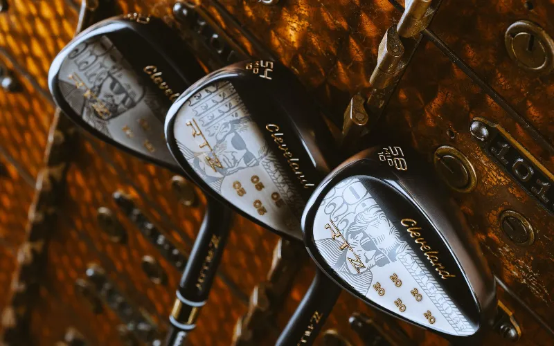 Limited-Edition SWAG RTZ Wedge from Cleveland Golf Three stylish golf wedges on display.