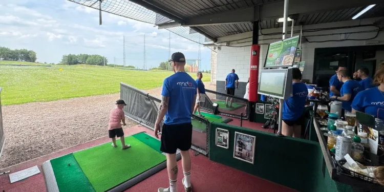 MNDriveathon5000 raises awareness and funds for MND a man and child playing golf
