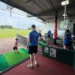 MNDriveathon5000 raises awareness and funds for MND a man and child playing golf
