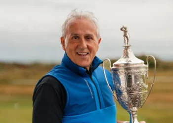Brother inspires Neil Roderick to retain Welsh title a man holding a trophy