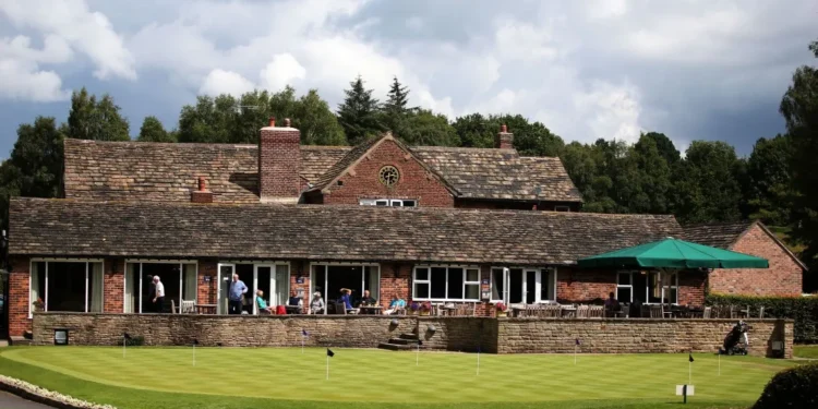 Prestbury’s Joan Crouch Wins Wild Cup at 90 Years Old a building with people sitting on the porch