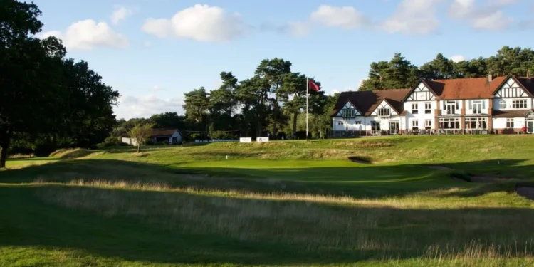 Cheshire Senior Ladies Championship 2025 a golf course with a building and a flag on the side