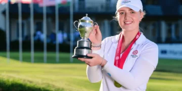 Sadie holding a trophy