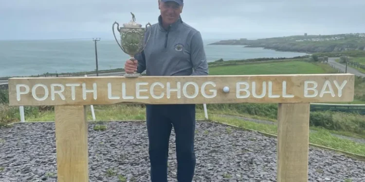 Sansome drives his way to Welsh title success a man holding a trophy