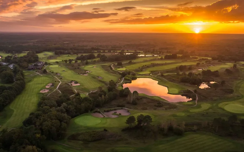 Cabot Bordeaux Combines World-Class Golf and Wine Stunning sunset over lush golf course.
