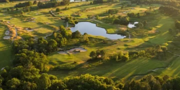 Lush golf course with serene water features.