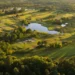 Cabot Bordeaux Combines World-Class Golf and Wine Lush golf course with serene water features.