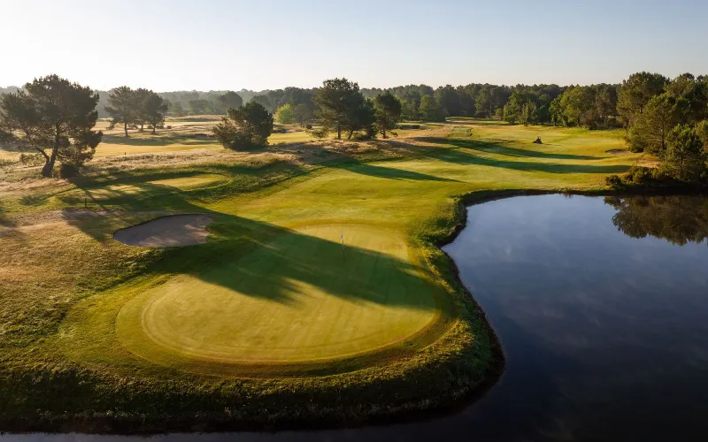 Cabot Bordeaux Combines World-Class Golf and Wine Lush golf course with serene water