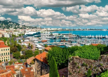 IGTM Reveals Key Golf Travel Trends for 2025 Scenic coastal view with boats and clouds