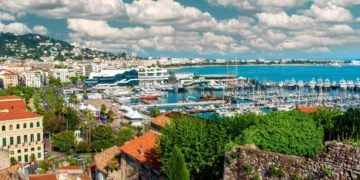 Scenic coastal view with boats and clouds