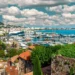 IGTM Reveals Key Golf Travel Trends for 2025 Scenic coastal view with boats and clouds