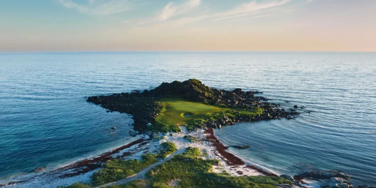 Lofoten Links Northern Lights Above the Arctic Circle Golf course surrounded by serene waters.