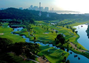 Sentosa Golf Club Launches Grass Trackman Range Lush golf course with city skyline backdrop