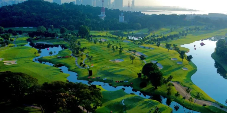 Sentosa Golf Club Launches Grass Trackman Range Lush golf course with city skyline backdrop