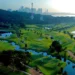 Sentosa Golf Club Launches Grass Trackman Range Lush golf course with city skyline backdrop