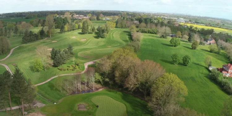 Dave Nelson Wins Fourth Cheshire Men's Senior Title Lush green golf course landscape aerial view.