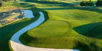 Lush golf course with winding fairways.